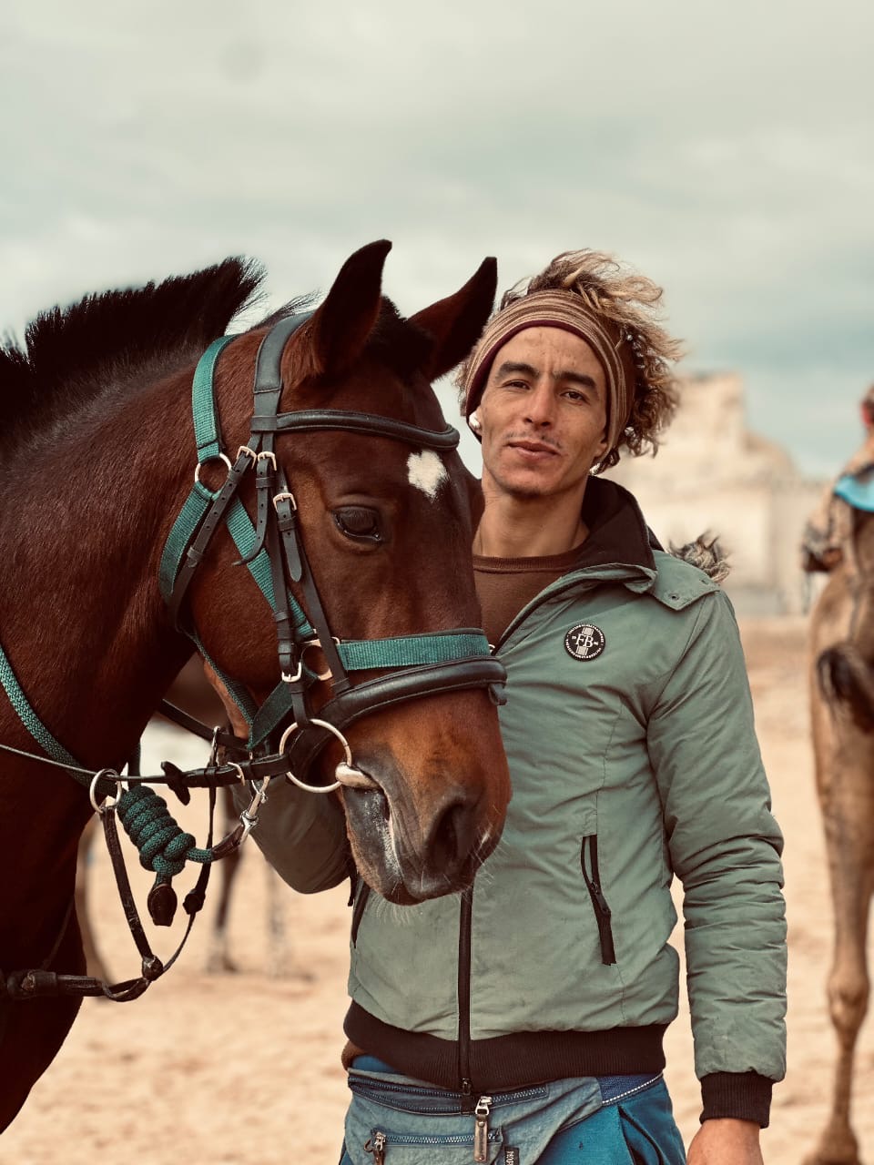 Mokhtar, your local guide, with one of his horses on the beach
