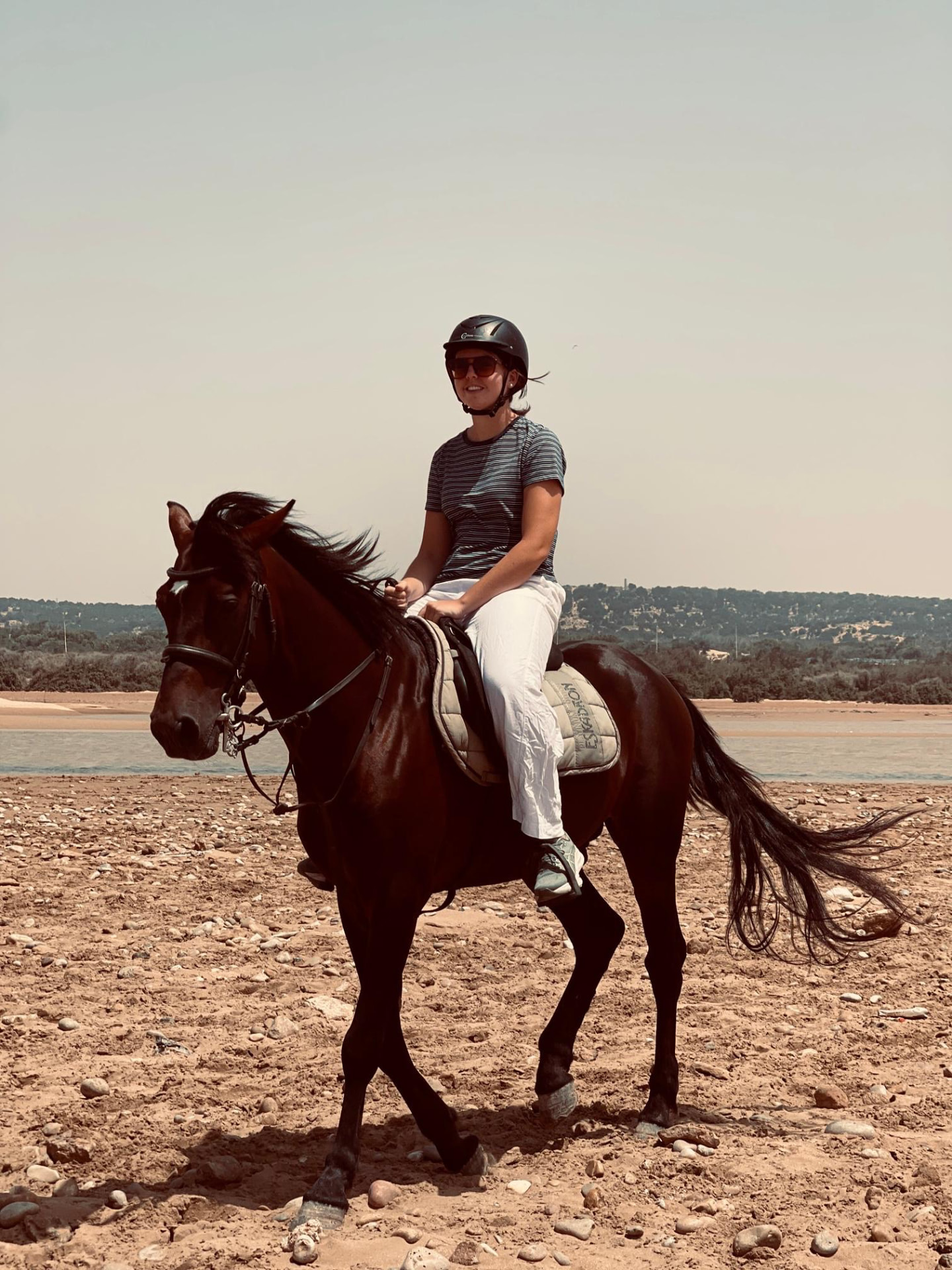Rider on Assif walking along the river mouth