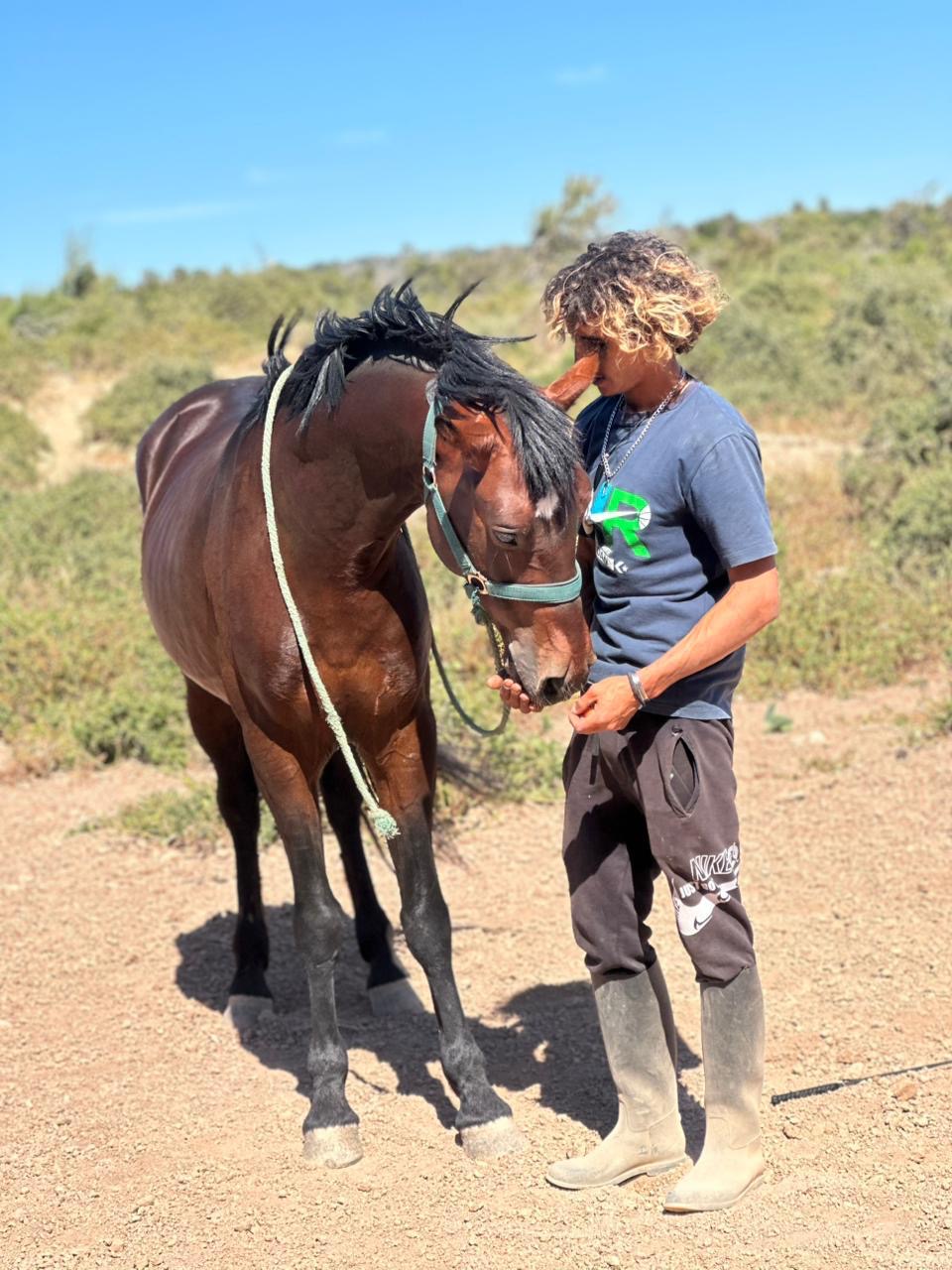 Mokhtar standing nose to nose with Assif in the argan bush